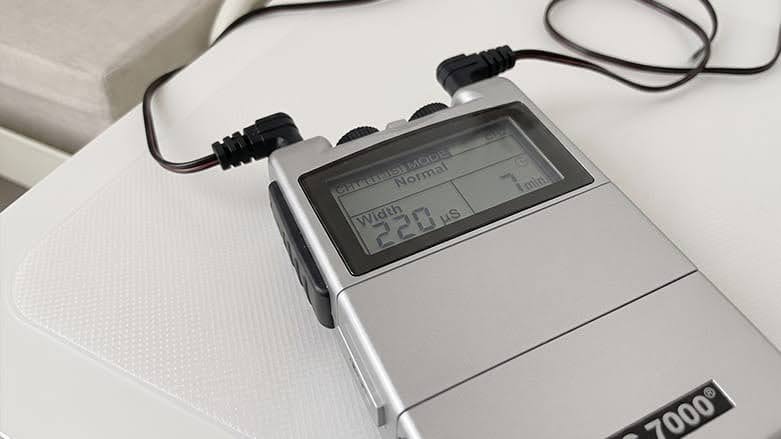 TENS 7000 Digital TENS Unit on table