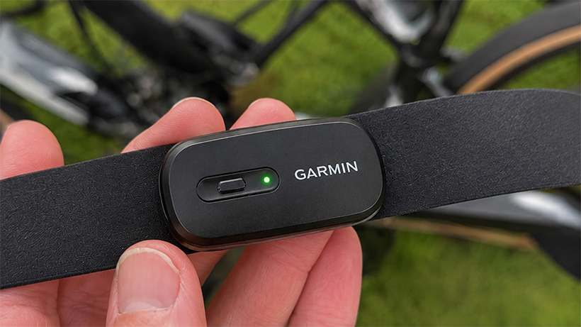 garmin hrm 200 in hand with bicycle