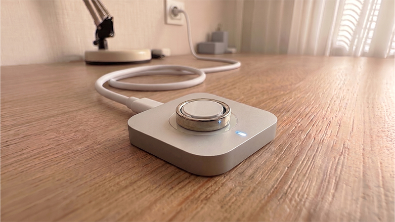 Oura Ring 5 on a charging dock