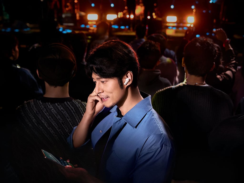 Huawei Earbuds in a busy area