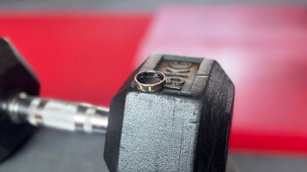 oura ring 5 placed on dumbbell